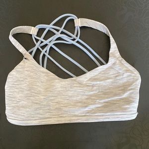 Stripped light and dark gray bra, with blue back